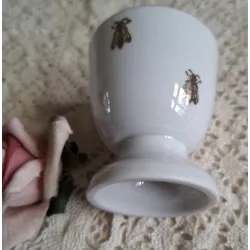 Porseleinen eierdopje Napoleon en goudkleurige bijtjes