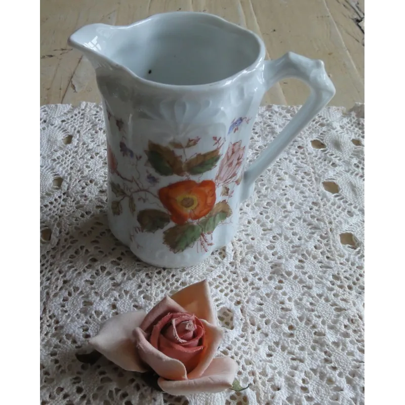 Brocante melkkannetje met bloemen