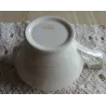 Oud creme melkannetje met gouden bloemetjes