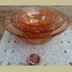 Nest van 4 vintage roze glazen schalen met reliëf